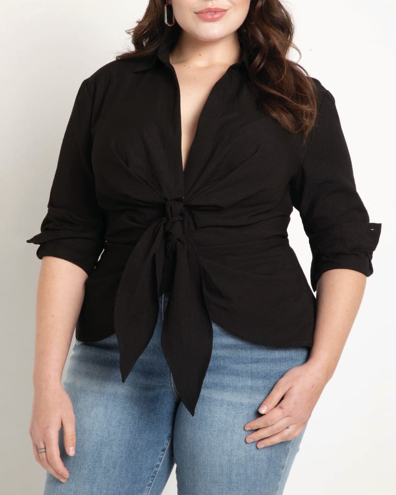 Front of a model wearing a size 14 Priscilla Tie Front Collared Blouse in Totally Black by ELOQUII. | dia_product_style_image_id:196154